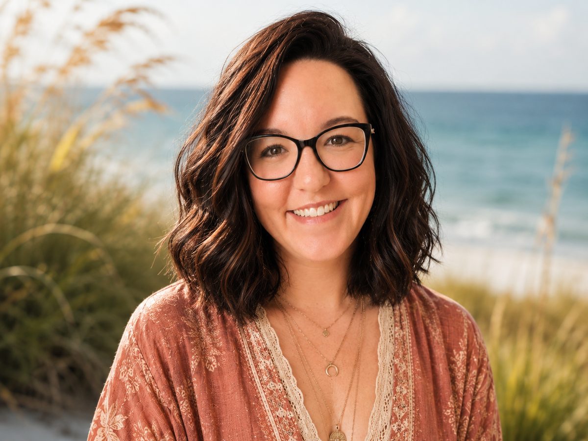 Claire Szewczyk, founder of Space Coast Stories, on a Florida beach